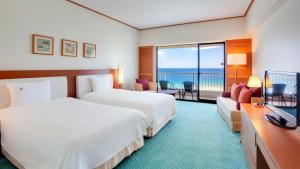 Postel nebo postele na pokoji v ubytování Hotel Nikko Guam