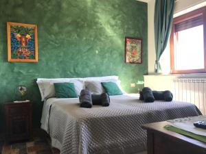 Ένα ή περισσότερα κρεβάτια σε δωμάτιο στο B&B Casamiranapoli