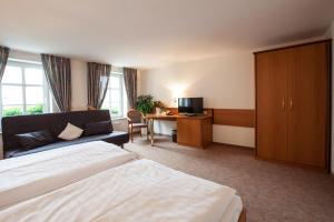 Postel nebo postele na pokoji v ubytování Hotel Reussischer Hof