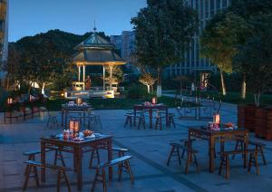 a group of tables and chairs with a gazebo at Shangri-La Suzhou in Suzhou