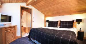 Postel nebo postele na pokoji v ubytování M de Megève