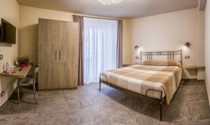 Postel nebo postele na pokoji v ubytování Borgomaestro B&B