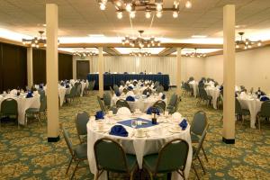a banquet hall with white tables and chairs at Red Lion Hotel Pendleton in Pendleton +37 photos