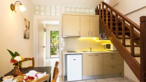 A kitchen or kitchenette at Trefon Hotel Apartments and Family Suites