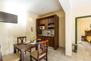 A kitchen or kitchenette at Trefon Hotel Apartments and Family Suites