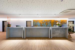 Lobbyen eller receptionen på mk | hotel rüsselsheim