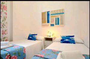 Posteľ alebo postele v izbe v ubytovaní Apartamento Alcazaba