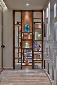 a room with wooden shelves with vases on them at Luna Holiday Complex in Mellieħa