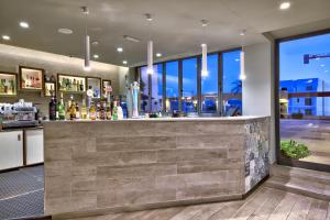 a bar in a building with a view at Luna Holiday Complex in Mellieħa