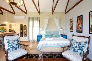 Un pat sau paturi într-o cameră la Lentelus Guesthouse