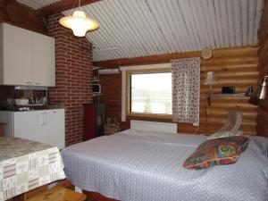 Postel nebo postele na pokoji v ubytování Ukonloma Cottages