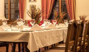 a table with wine glasses and napkins on it at Bulawayo Club in Bulawayo