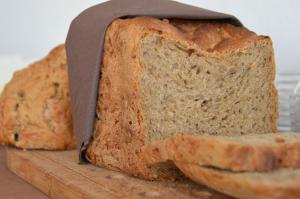 a loaf of bread sitting on a cutting board at B&B Casa Agradable in Arenas