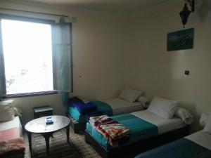 Postel nebo postele na pokoji v ubytování Hotel Coeur de Mogador