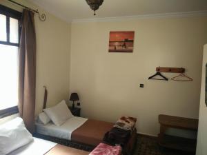 Postel nebo postele na pokoji v ubytování Hotel Coeur de Mogador