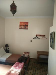 Postel nebo postele na pokoji v ubytování Hotel Coeur de Mogador