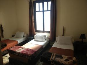 Postel nebo postele na pokoji v ubytování Hotel Coeur de Mogador