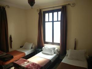 Postel nebo postele na pokoji v ubytování Hotel Coeur de Mogador