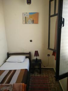 Postel nebo postele na pokoji v ubytování Hotel Coeur de Mogador