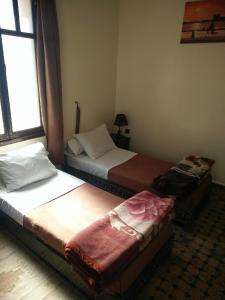 Postel nebo postele na pokoji v ubytování Hotel Coeur de Mogador