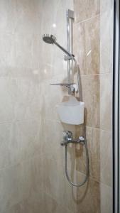 a bathroom with a shower with a sink at White home-apartament in Burgas +78 photos