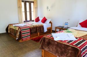 Letto o letti in una camera di Tiger Residency Resort