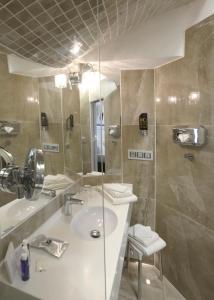 Kúpeľňa v ubytovaní Hotel Grand