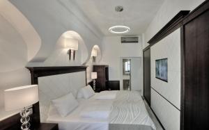 Posteľ alebo postele v izbe v ubytovaní Hotel Grand