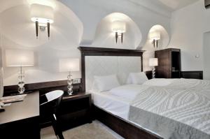 Posteľ alebo postele v izbe v ubytovaní Hotel Grand