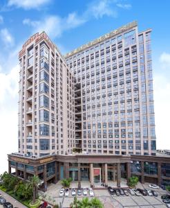 a large building with a courtyard in front of it at Zhongtian Mayfair Hotel - Bao'an International Airport Xixiang Subway Station in Shenzhen