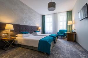 Posteľ alebo postele v izbe v ubytovaní Tulip Hotels - Wroclaw Patio