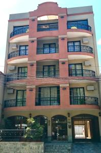 a large building with a large window on the side of it at Altoparque Hotel Salta in Salta