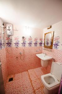 a bathroom with a toilet and a sink at Dream Villa in Mirissa +68 photos