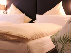 Baum´s Rheinhotelにあるベッド