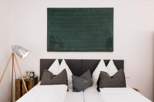 Łóżko lub łóżka w pokoju w obiekcie Hotel & Gourmetwirtshaus Kirchenwirt seit 1326