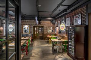 a restaurant with tables and chairs and brick walls at AmstelSki in Bukovel