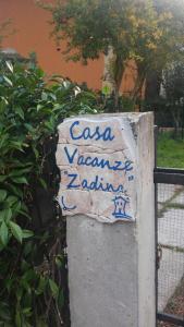 a sign that says lasagna vennaiane on a wall at Casa Vacanze Zadina in Cesenatico
