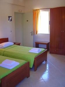 Postel nebo postele na pokoji v ubytování Ostria Hotel