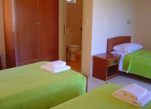 Postel nebo postele na pokoji v ubytování Ostria Hotel