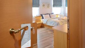 Ένα ή περισσότερα κρεβάτια σε δωμάτιο στο Dilofo Hotel Luxury Suites