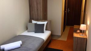 Postel nebo postele na pokoji v ubytování Hostel Fortis