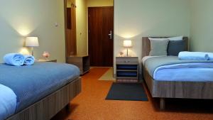 Postel nebo postele na pokoji v ubytování Hostel Fortis