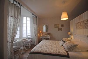 Katil atau katil-katil dalam bilik di Au fil du temps
