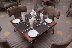 A restaurant or other place to eat at Heritage Continental Hotel