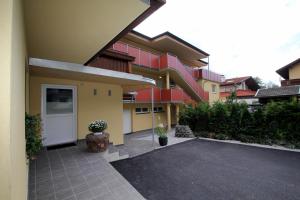 a courtyard of a building with a white door at Café-Pension Margret in Zirl