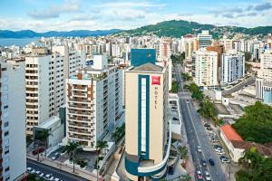 a city with tall buildings and tall buildings at Ibis Florianopolis in Florianópolis