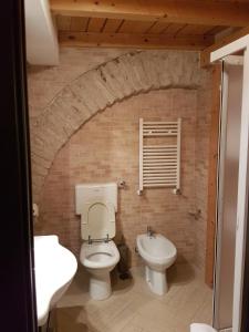 a bathroom with a toilet and a sink at Il Purgatorio in Barletta +14 photos