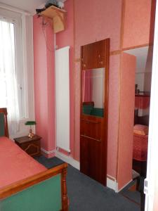 Postel nebo postele na pokoji v ubytování Hotel du Gambrinus