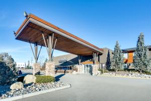 a building with a pavilion in a parking lot at Heritage Inn Hotel & Convention Centre - High River in High River