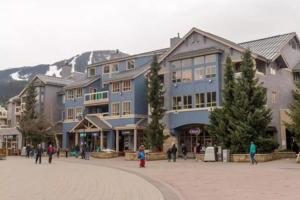 a group of buildings on a street in a town at R & R Retreat Luxury Condo in Whistler
